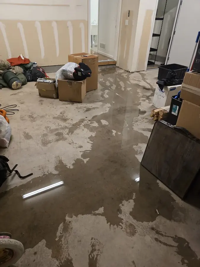 Flooded finished basement being pumped out in Colorado Springs