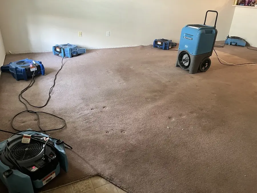 Water damage drying equipment in a Colorado Springs home after a burst pipe