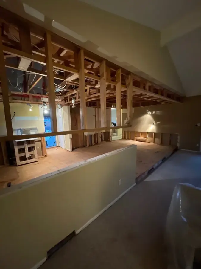 Exposed ceiling and roof framing in a Colorado Springs home after a roof leak